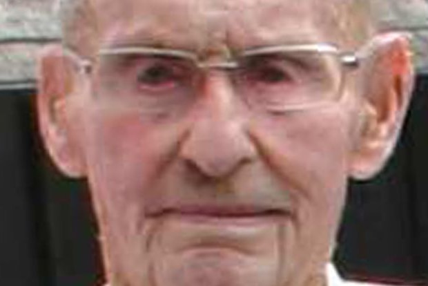 A grainy image of an elderly man