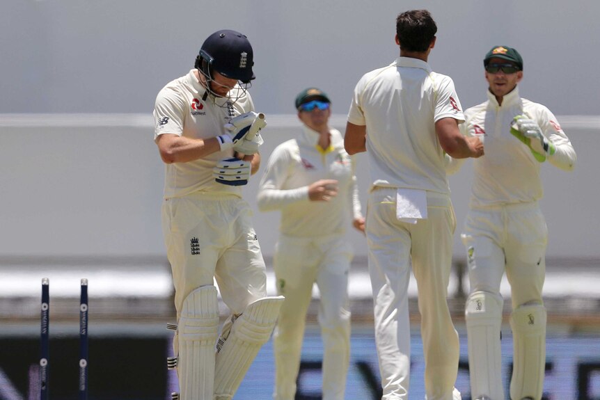 England's Jonny Bairstow walks off after being clean bowled by Mitchell Starc