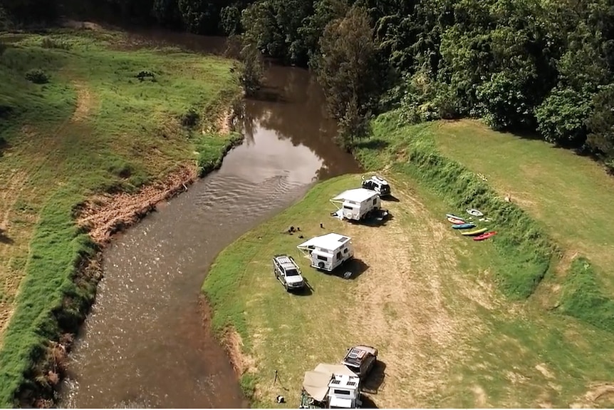 Aerial showing campers by the river.