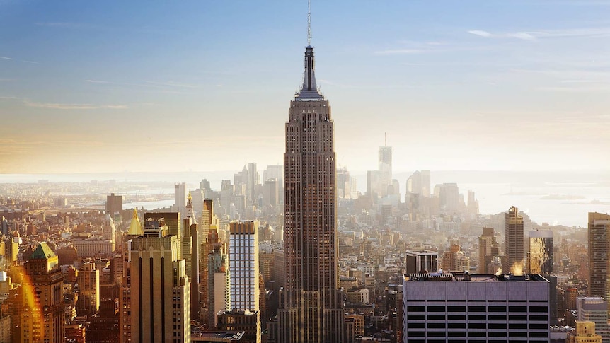 Tall buildings crowd into a busy skyline, with the iconic Empire State Building dwarfing them all in centre frame.