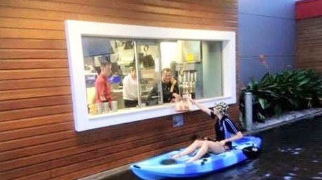 Woman kayaks through flooded drive-through at Port Lincoln McDonald's