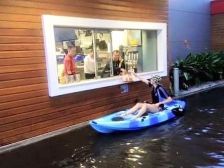 Woman kayaks through flooded drive-through at Port Lincoln McDonald's