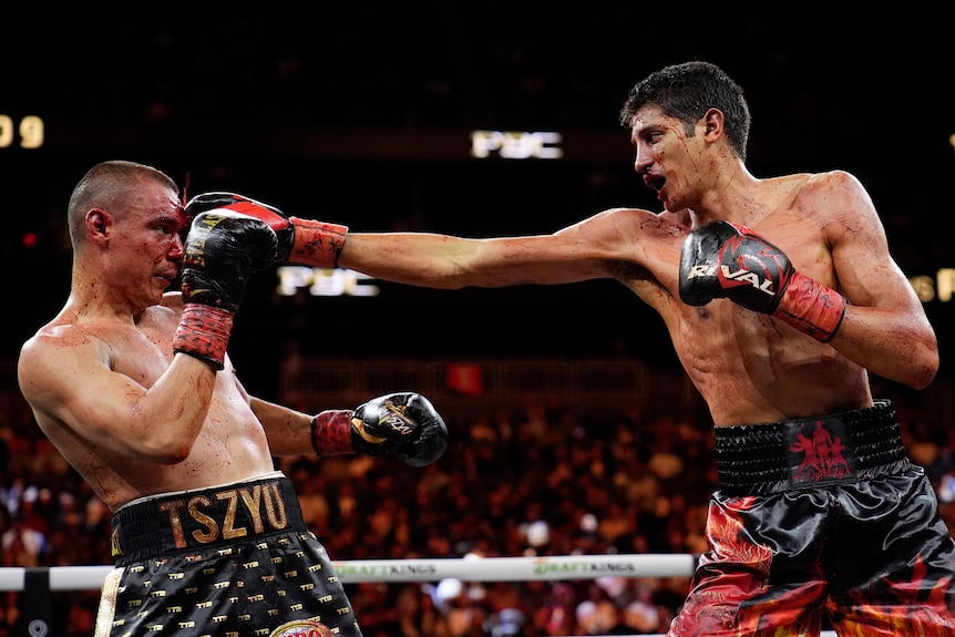 Boxer Sebastian Fundora touches Tim Tszyu with a right jab.