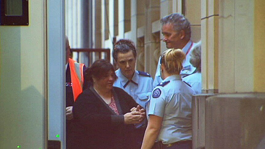 Angela Maree Williams is escorted into court for sentencing in Melbourne