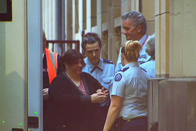 Angela Maree Williams is escorted into court for sentencing in Melbourne