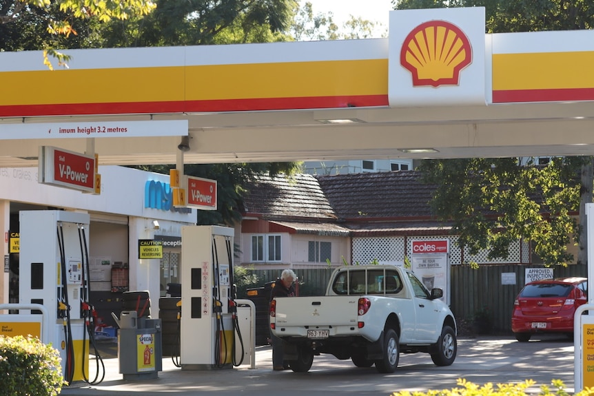 Vehicle at petrol bowser at Shell and Coles Xpress service station in Brisbane