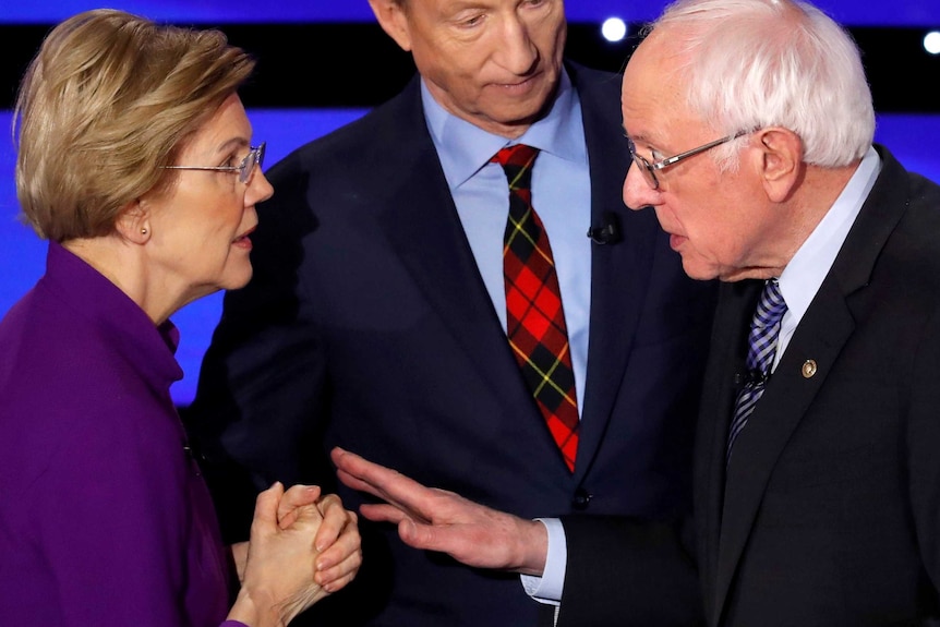 Democratic 2020 US presidential candidates (L-R) Senator Elizabeth Warren (D-MA) speaks with Senator Bernie Sanders.