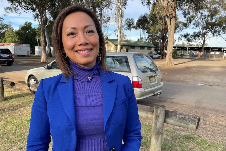 A woman wearing a blue jacket