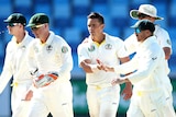 Australia's Stephen O'Keefe is congratulated for a Test wicket against Pakistan in Dubai in 2014.
