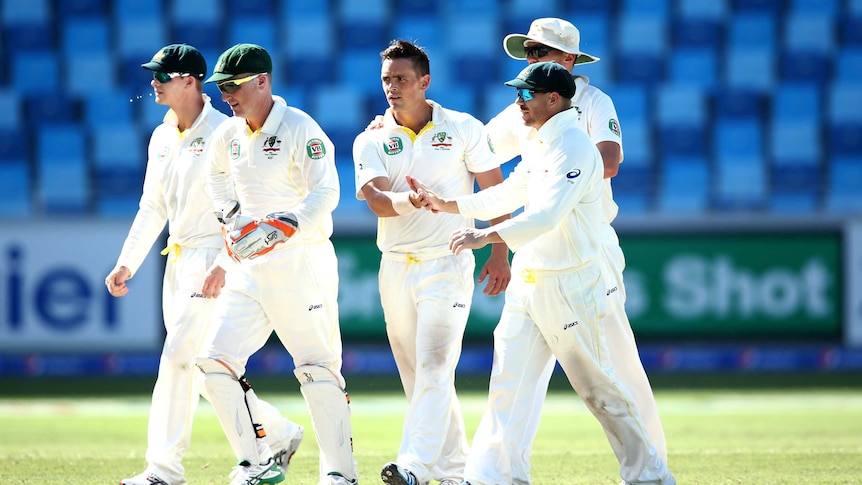 Australia's Stephen O'Keefe is congratulated for a Test wicket against Pakistan in Dubai in 2014.