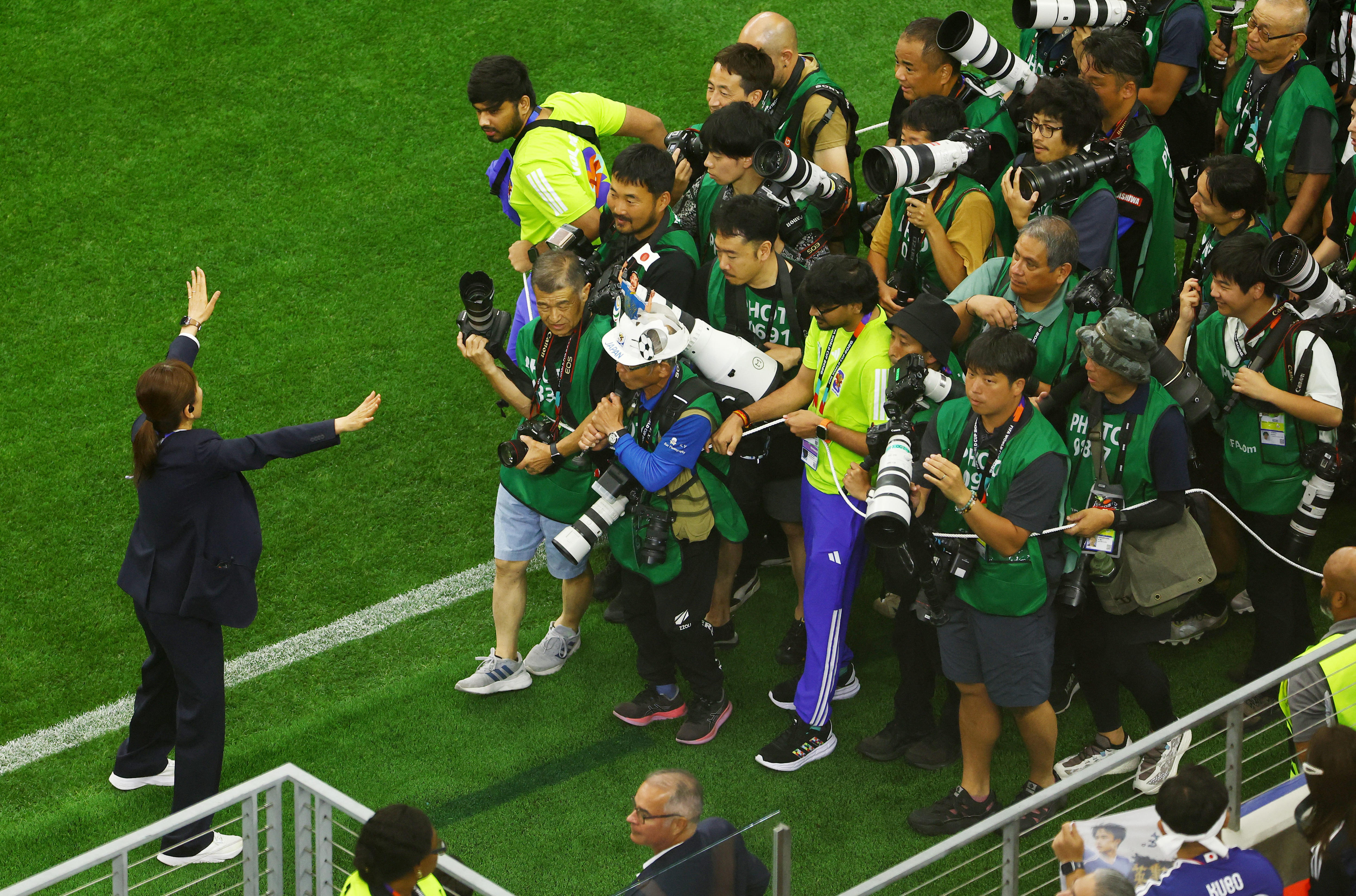 Media photographers wait for the teams to walk out before the match.