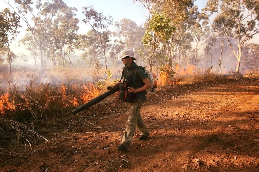 A firefighter on the frontlines of a masive bushfire on the Gibb River Road.