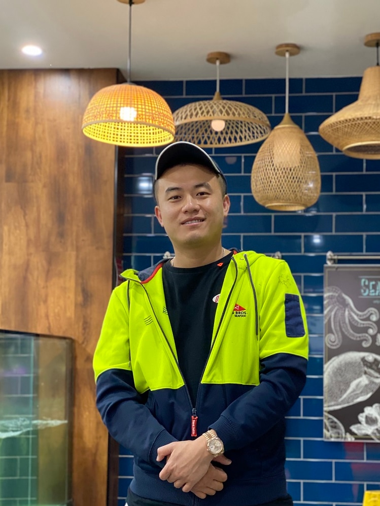 Alvin Miao stands in his Box Hill fish shop.