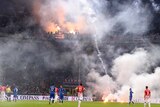 Croatian fans light flares and fireworks at match against Italy