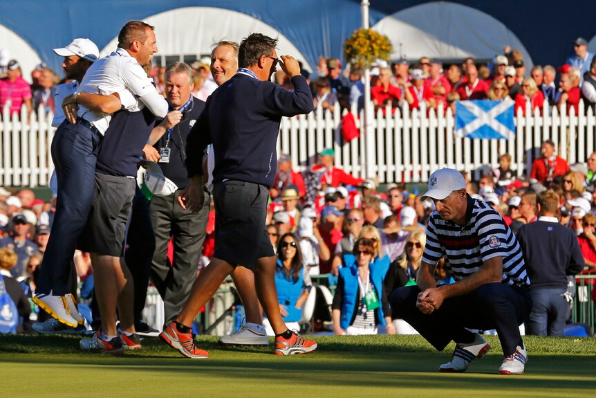 Jim Furyk misses his putt on the 18th to hand Sergio Garcia victory.