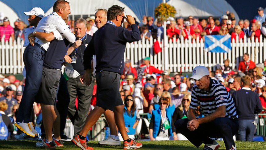 Jim Furyk misses his putt on the 18th to hand Sergio Garcia victory.