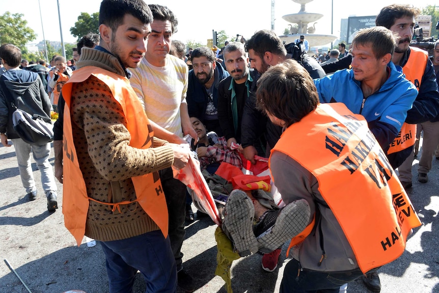 An injured person carried after Ankara bomb blast