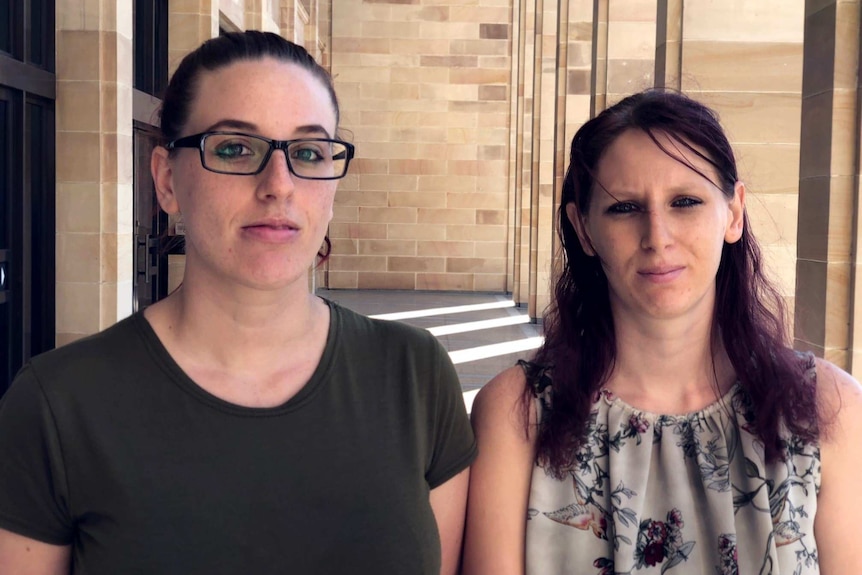 Skye Quartermaine and her sister Dee on the steps of Parliament House