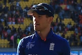 Eoin Morgan leads dejected England off the field