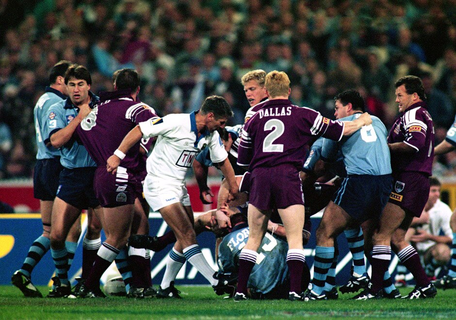 A fight breaks out between players during a State of Origin match adjudicated by Eddie Ward