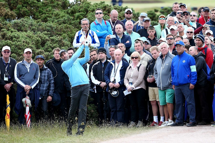 Geoff Ogilvy hits out of the rough at British Open
