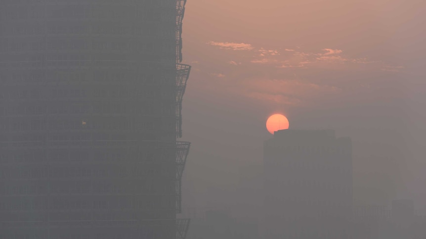 The sunset is seen through smog in Zhengzhou in the Henan province of China.