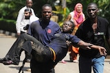 Woman is carried from Kenyan shopping mall after attack