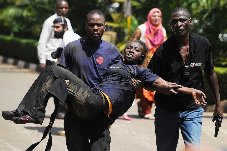 Woman is carried from Kenyan shopping mall after attack