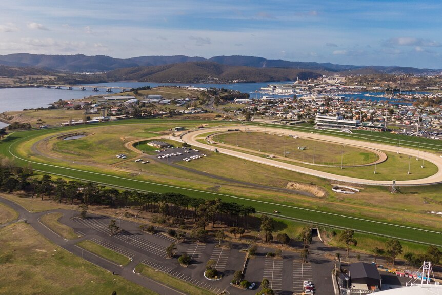 Aerial photographs of a horse racing track.