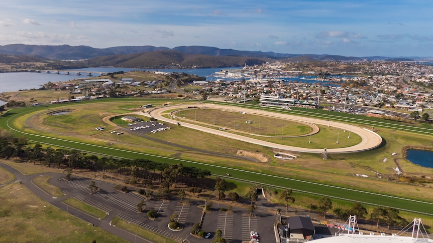 Aerial photographs of a horse racing track.