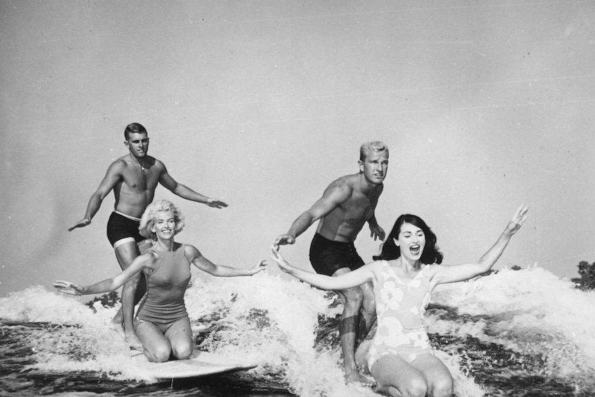 Two couples surfboarding in Florida in 1965