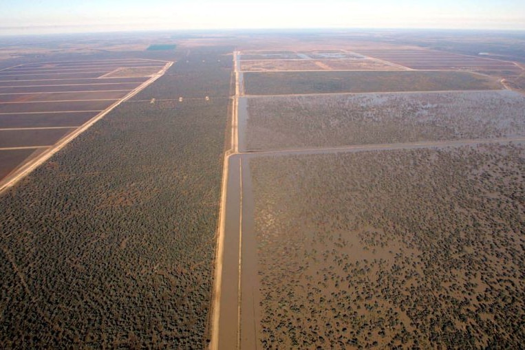 Aerial shot of farmland and irrigation channels.