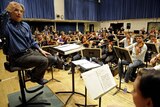 Members of the YouTube Symphony Orchestra rehearse under the direction of Michael Tilson Thomas.