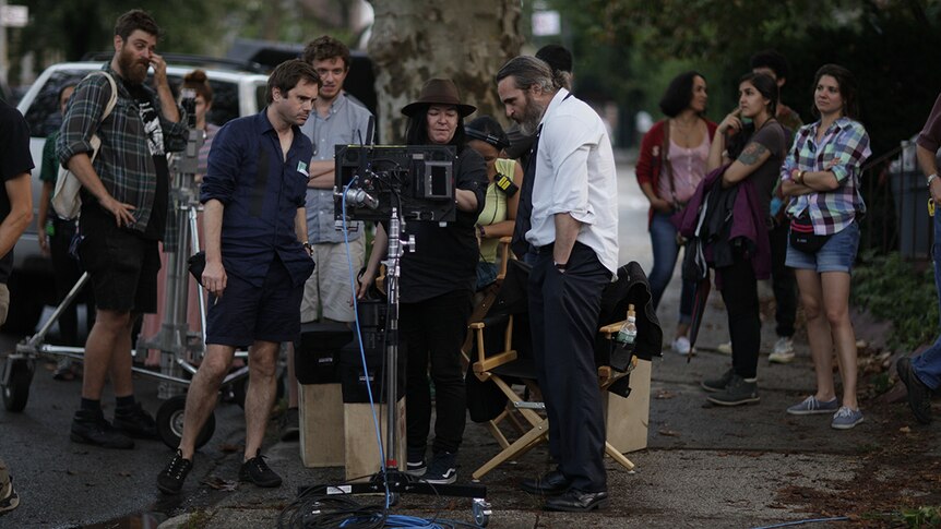 Cinematographer Tom Townend, director Lynne Ramsay, actor Joaquin Phoenix working on the set of You Were Never Really Here.