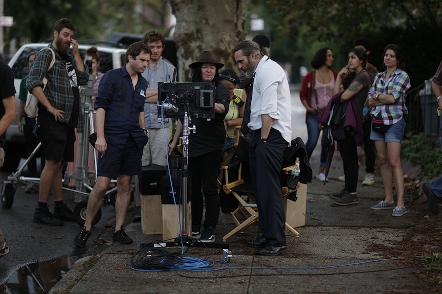 Cinematographer Tom Townend, director Lynne Ramsay, actor Joaquin Phoenix working on the set of You Were Never Really Here.