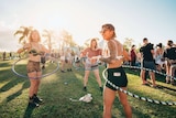 Three young people at a music festival