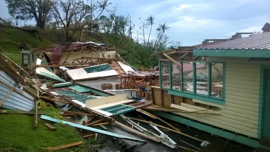 Exterior view of a wooden house blown apart by Cyclone Winston.