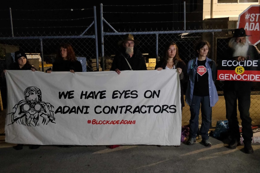 Climate change protesters block the front gates of premises of an Adani contractor.