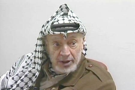 Yasser Arafat speaking at a press conference after the suicide bombing