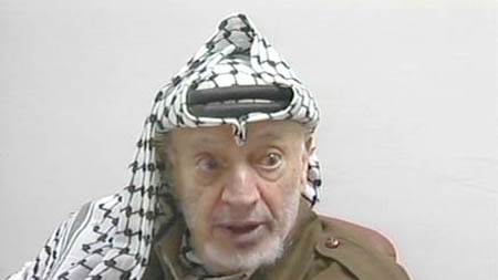 Yasser Arafat speaking at a press conference after the suicide bombing