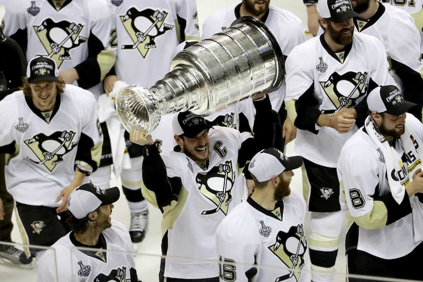 Pittsburgh Penguins star Sidney Crosby celebrates with the Stanley Cup