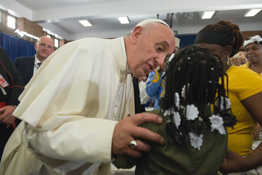 Pope Francis greets people inside of Our Lady Queen of Angels School in East Harlem in New York, September 25, 2015.