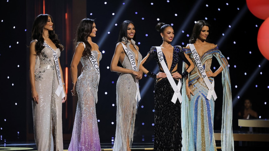 The top five finalists in the 71st Miss Universe pageant in New Orleans, wearing sashes and sparkly dresses.