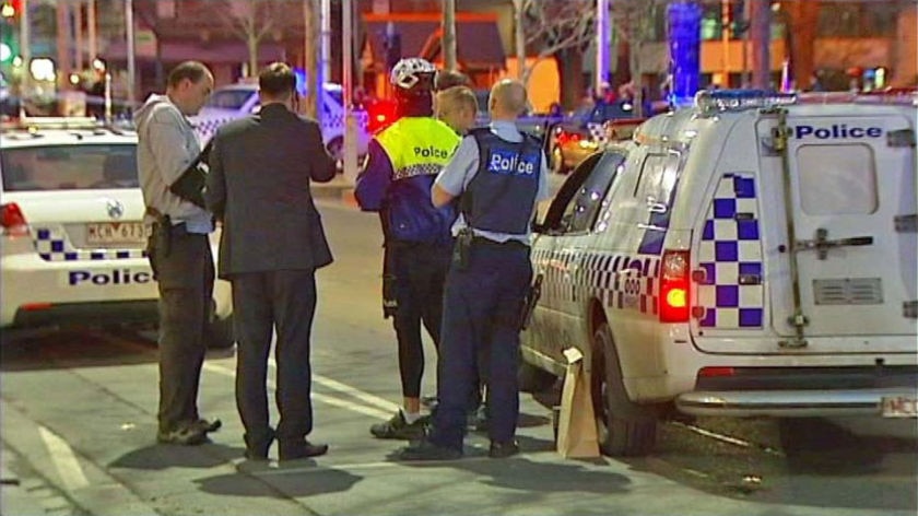 Police set up blockades on Lygon Street.