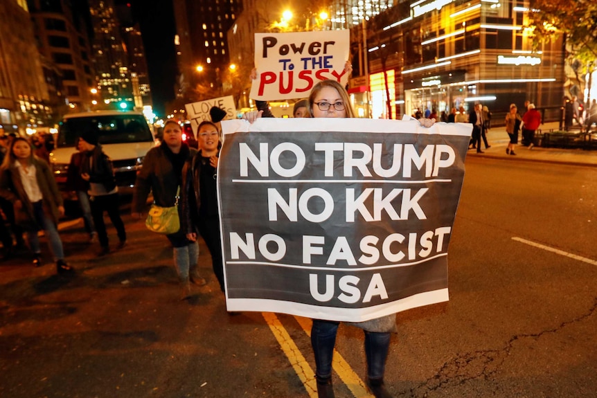 Protesters walk during a protest against Republican president-elect Donald Trump in Chicago.