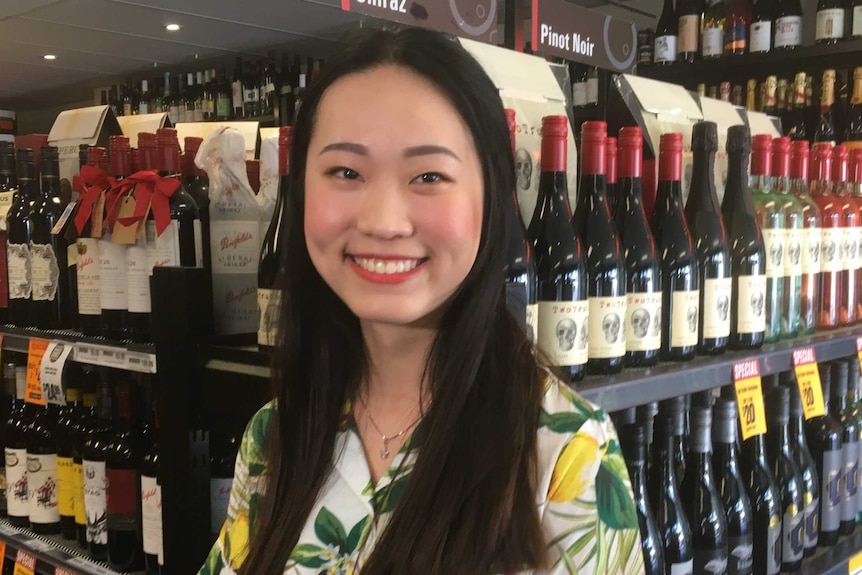 Linh Huang inside the bottle shop where she works at Chelsea.
