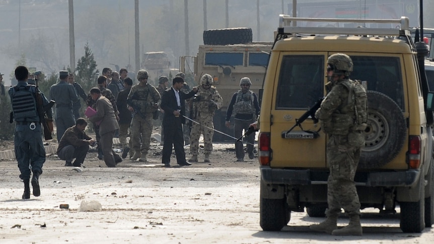 Afghanistan's security force and rescue personnel with NATO troops in Kabul