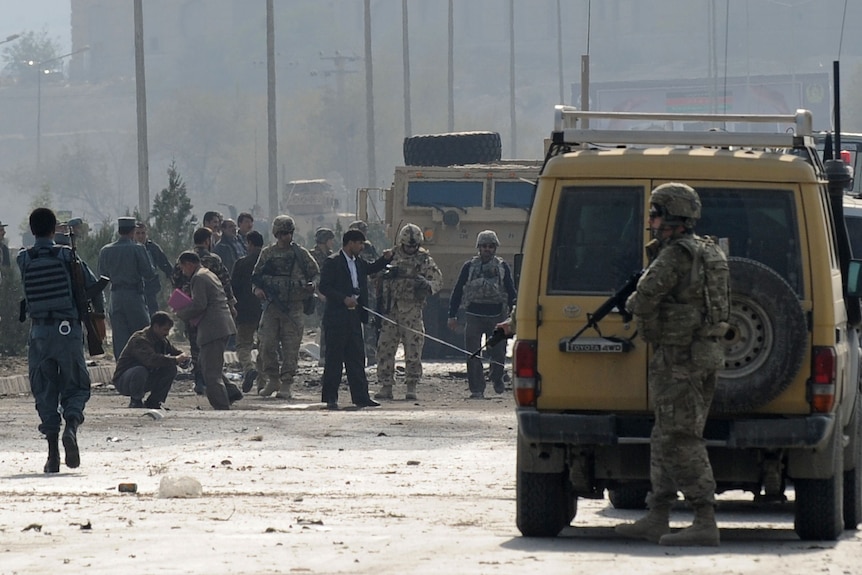 Afghanistan's security force and rescue personnel with NATO troops in Kabul