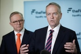 Bill Shorten gestures while speaking at a press conference
