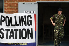 A soldier in the Royal Artillery leaves a polling station after casting his vote (Reuters/Luke MacGregor)